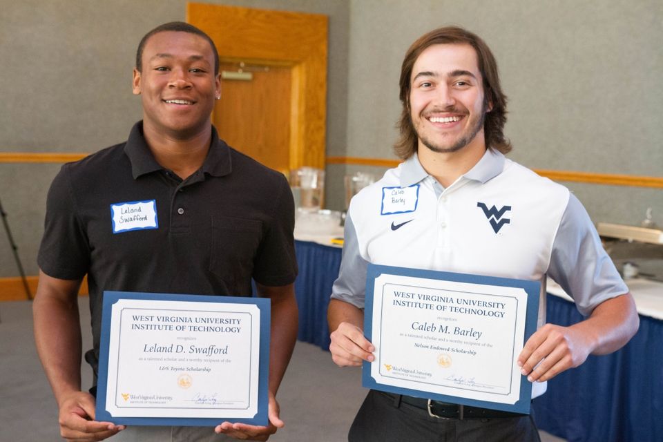 WVU Tech students stand with their scholarship certificates at a special scholarship event.